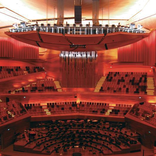 Concert hall with acoustic canopy and sound curtains