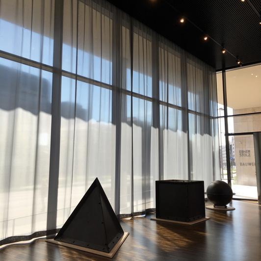 Transparent soundproof curtain in the foyer with geometric figures