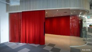 Red acoustic curtain to separate the quiet zone in the office