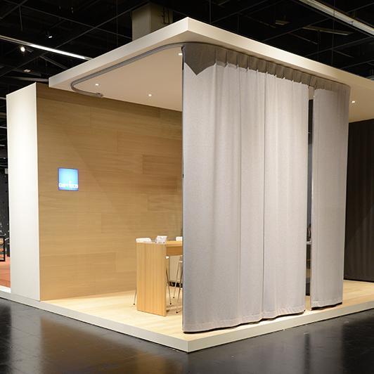 Gerriets exhibition stand with acoustic curtain and integrated viewing window