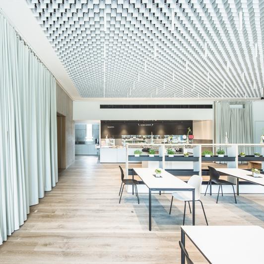 Cafeteria with acoustic curtains and special ceiling construction