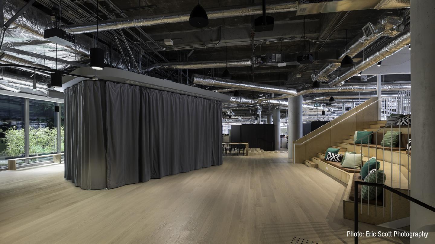 Closed soundproof curtain in open-plan office for meetings